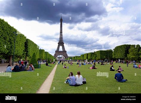 The Eiffel Tower And The Parc Du Champ De Mars With Tourists Paris