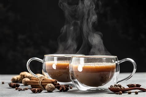 Two Mugs Of Masala Tea Hot Indian Masala Chai Tea With Milk And Spices In A Glass Glass On Dark