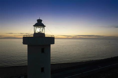 Aerial view of a maritime lighthouse taken at night 27090717 Stock Photo at Vecteezy