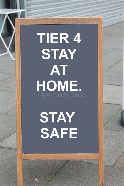 Tier 4 Stay At Home Stay Safe Covid Message On A Chalk Board Stock