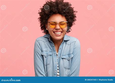 Smiling Content Dark Skinned Girl Closes Eyes And Smiles Broadly Being