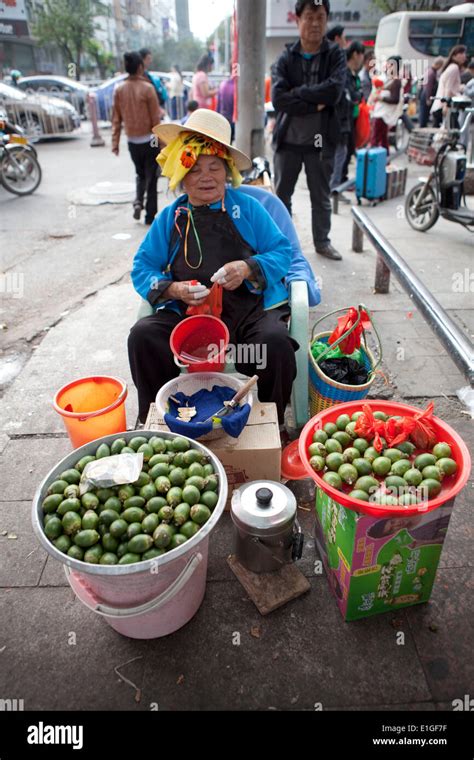 A Woman Selling A Betel Nuts On The Street In Sanya Hainan China On