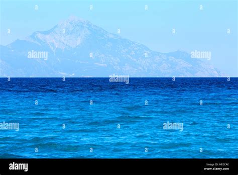 Aegean Sea Coast Landscape With Aquamarine Water And Mount Athos In