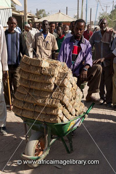 Photos And Pictures Of Money Changers Carry Loads Of Low Value Notes