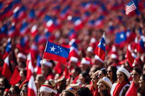 Premium Photo People In A Large Crowd Are Holding Flags And One Of