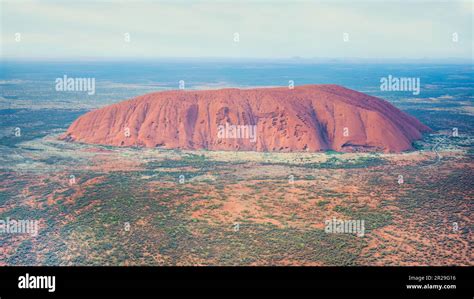 Uluru - Ayers Rock, Northern Territory, Australia; May 18, 2023 - Aerial view at sunrise of ...