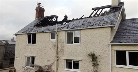 Firefighters Tackle House Blaze As Flames Rip Through Roof And First