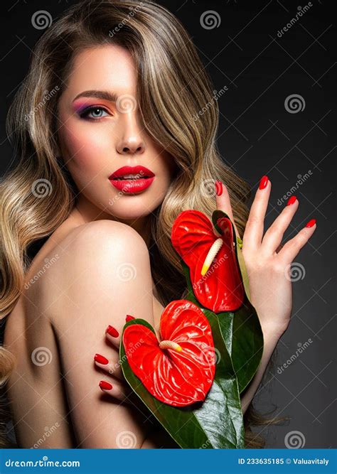 Beautiful Blonde With Red Flowers Covers Her Bare Breasts Portrait Of A Long Haired Blonde With