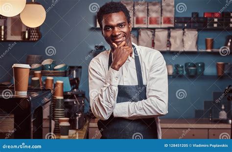 Portrait Of Successful African American Owner Small Business Smiling At