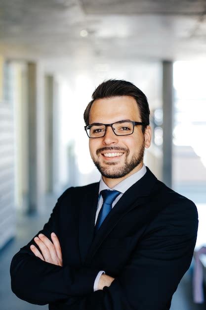 Premium Photo Close Up Portrait Of Smiling Businessman Wearing Eyeglasses