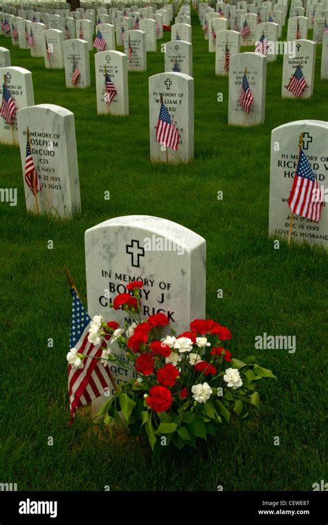 Grouping of headstones and American flags, Fort Logan National Cemetery ...