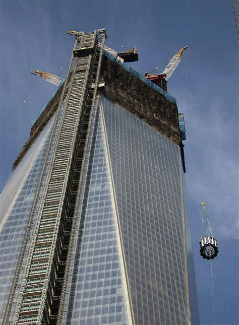 Spire Hoisted Atop Wtc