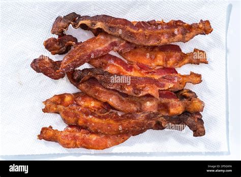 Cooking bacon strips Stock Photo - Alamy