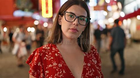 Beautiful Hispanic Woman Serious Expression Behind Glasses Stands