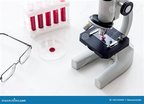 Blood Testing Laboratory Samples Viewing Under Microscope Near Tubes