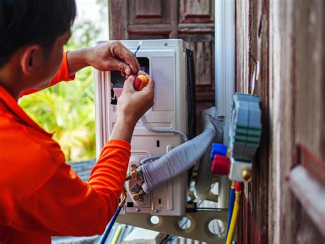 Air conditioning technicians install new compressor air Use a