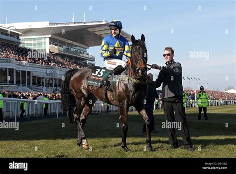 Ryan Mania celebrates on Auroras Encore after winning the John Smith's ...