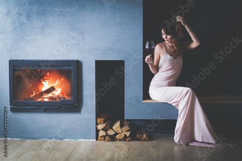 Sexy Woman In Front Of The Fireplace Wood Fireplace Stock Photo And