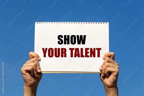 Show Your Talent Text On Notebook Paper Held By 2 Hands With Isolated