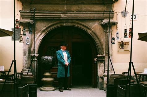 Elderly Man Knocking on House Front DoorsFree Stock Photo