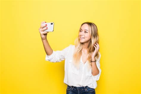 Free Photo Portrait Of Woman Take Selfie Holding Smart Phone In Hand