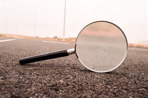 Magnifying Glass On The Road Stock Photo At Vecteezy