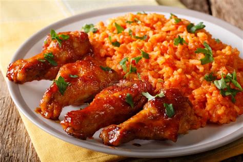 Nigerian Food Party Jollof Rice With Fried Chicken Wings Close Up