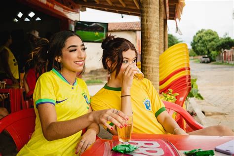 Two Young Woman Drinking at an Outdoor Bar · Free Stock Photo