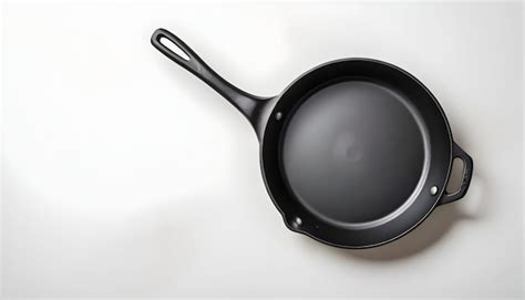 Empty Cast Iron Frying Pan Over White Background View From Above Food