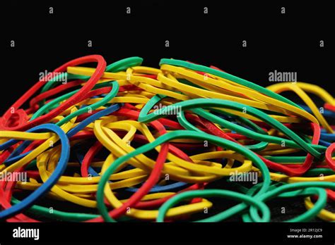 close    colored rubber bands isolated   black