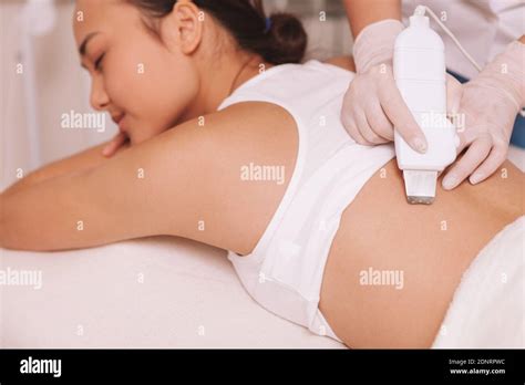 Professional Cosmetologist Using Ultrasound Cavitation Machine On The