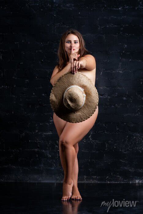 Naked Sexy Plus Size Model Hiding Behind Hat On Black Background