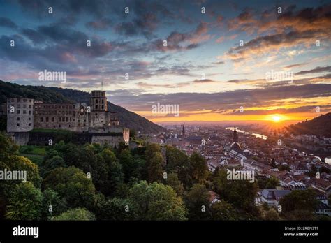 The famous castle of Heidelberg and the Old Town at sunset. Image taken ...