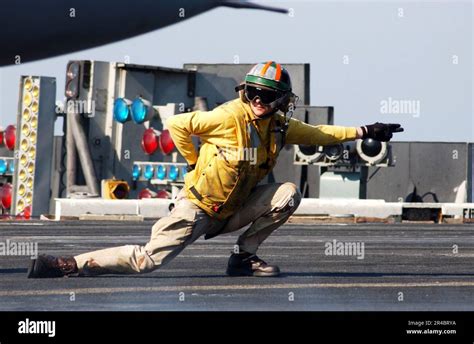 US Navy Lt Cmdr Gives The Signal To Launch An F 14D Tomcat On The