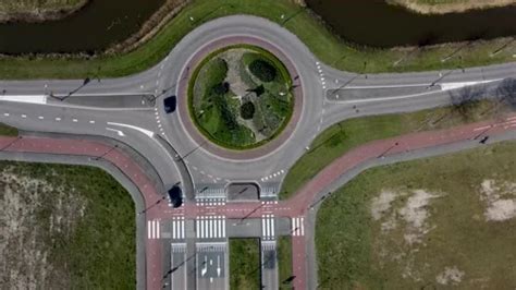 Roundabout at the intersection of two as... | Stock Video | Pond5