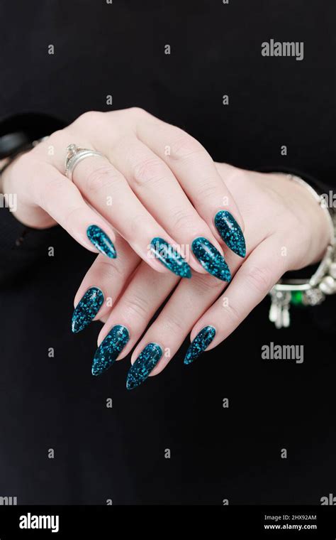 Woman S Beautiful Hand With Long Nails And Teal Green And Blue Manicure