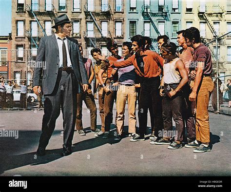 WEST SIDE STORY, Simon Oakland (suit), George Chakiris (arm ...