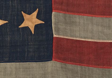 ANTIQUE AMERICAN FLAG WITH 13 HAND SEWN STARS IN AN EXTREMELY RARE