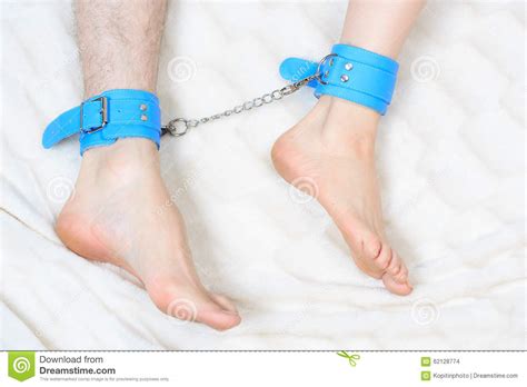 Male And Female Legs In Handcuffs Couple Sex Toy Stock Photo Image