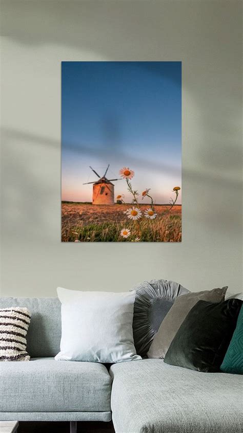 A Living Room Scene With Focus On The Couch And Windmills In The Back