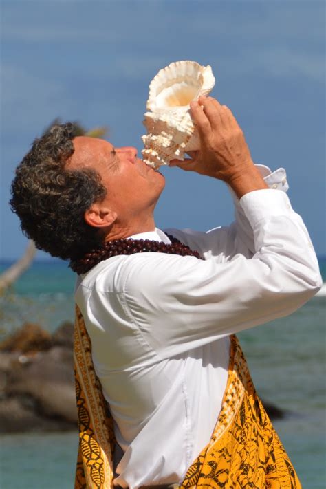 Hawaii Wedding Vendors Blowing The Conch Shell