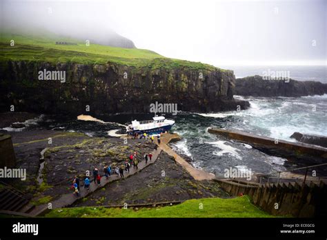 Visitors arrive at Mykines island in ferry called Jósup, Faroe Stock ...