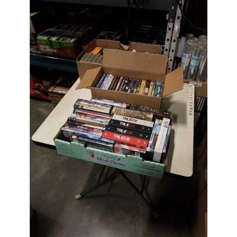 3 Trays Of Dvds Includes Series And New Blank Vhs Tapes