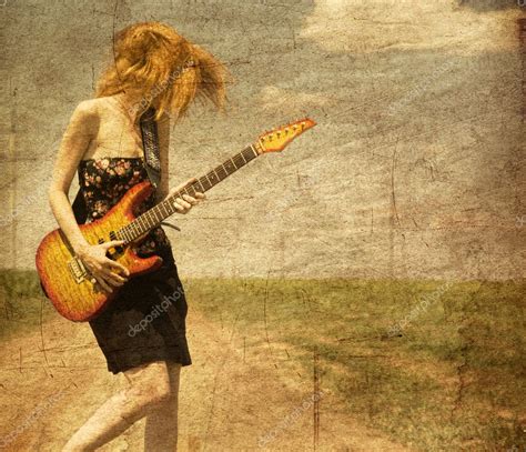 Red-head girl with guitar. — Stock Photo © massonforstock #6448869