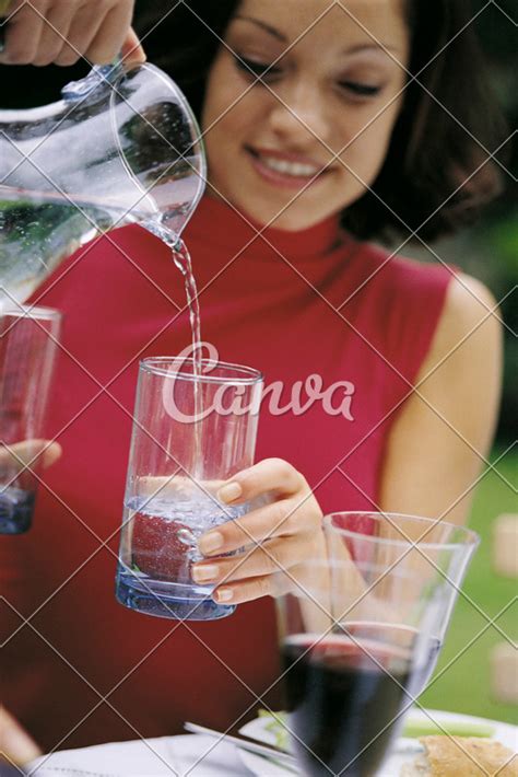 Woman Pouring Water Photos By Canva