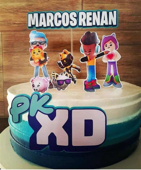 There Is A Cake Decorated With Cartoon Characters On It And The Words Pkd