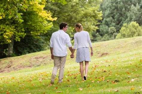 Couple Walking Hand In Hand Stock Photo Image 50963202