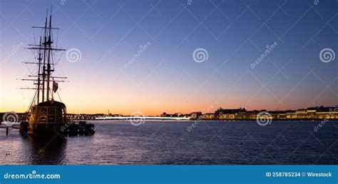 Cruise Ship on the Sea at Sunset with Buildings in the Background Stock ...