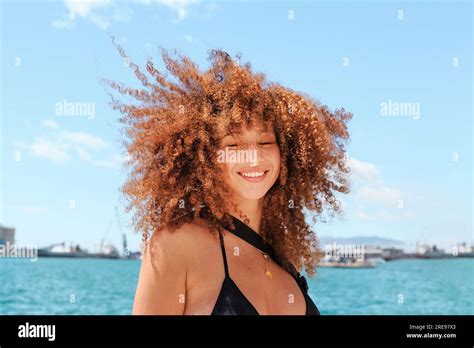 From Below Of Content Female In Bikini Top And Shorts Enjoying Summer