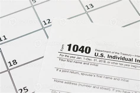 Irs Form 1040 Individual Income Tax Return Blank Lies On Empty Calendar